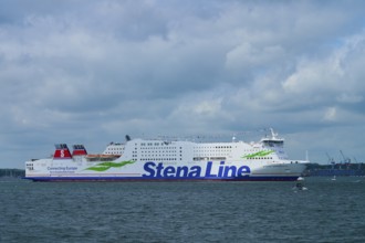 Stena Line ferry sails calmly across the sea under a dramatic, cloudy sky, Windjammer Parade Kiel
