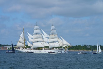 An impressive tall ship Gorch Fock with white sails off the coast, Windjammer Parade Kiel 2025,