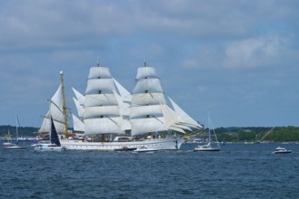 A large sailing ship Gorch Fock with white sails on the water, Windjammer Parade Kiel 2025,