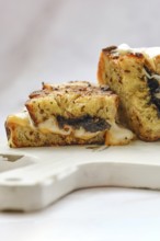 Melted cheese oozes from the sides of a perfectly toasted three cheese sandwich, showcasing a
