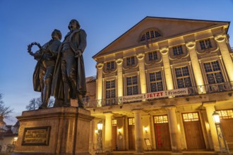 The German National Theatre with the Goethe and Schiller Monument at dusk, Weimar, Thuringia,
