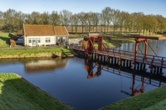 Moat and drawbridge of the inhabited former Bourtange fortress, Groningen, Netherlands
