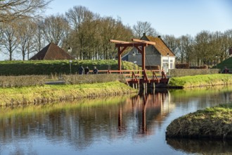 Moat and drawbridge of the inhabited former Bourtange fortress, Groningen, Netherlands