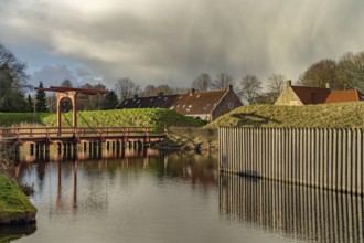 Moat and drawbridge of the inhabited former Bourtange fortress, Groningen, Netherlands