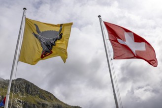 Swiss and Uri flag, blowing in the wind, Gotthard Pass, Gottardo, Ticino, Switzerland