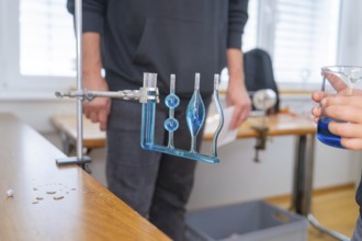 Measuring device with blue liquid in a laboratory for experimental purposes, Youth Research Centre
