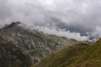 Clouds and view of Gotthard pass road, Passo Scimfuss, Ticino, Switzerland