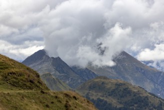 View over Passo Scimfuss to Pizzo del Sole in the clouds, Airolo, Ticino, Switzerland