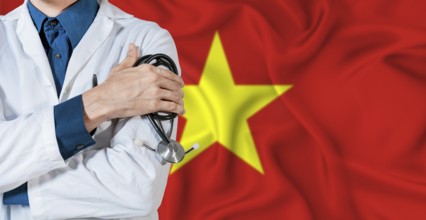 Doctor with stethoscope on Vietnam flag. Doctor holding stethoscope on Vietnamese flag