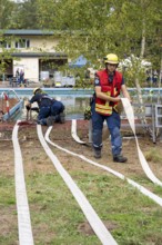 Emergency services practise the use of pumps that are used, for example, during floods, at an old
