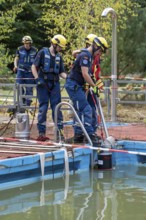 Emergency services practise the use of pumps that are used, for example, during floods, at an old