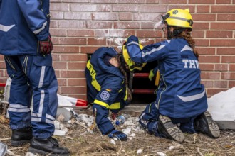 Rescue and recovery of people after a drone attack on a residential building in a civil defence