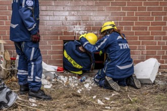 Rescue and recovery of people after a drone attack on a residential building in a civil defence