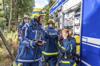 Civil defence exercise scenario, after a drone attack on a residential area, emergency services