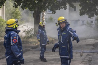 Civil defence exercise scenario, after a drone attack on a residential area, emergency services