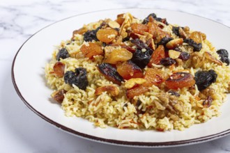 Rice dish, with the addition of dried fruits, nuts and spices of Middle Eastern cuisine, homemade,