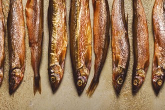 Cold smoked capelin, on the table, top view, no people