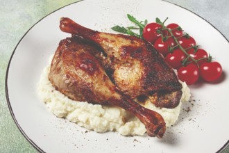 Fried duck shank, cauliflower puree, cherry tomatoes, homemade, no people