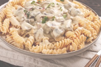 Fusilli pasta, with champignons in creamy garlic sauce, with herbs and spices, sauce, no people