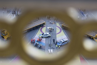 Police and emergency services on the big star seen through the parapet of the Victory Column at the