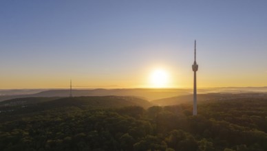 Atmospheric landscape with television tower and forest at sunrise, quiet atmosphere, Stuttgart,