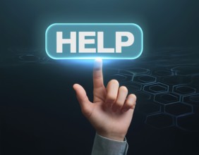 Hand point at an illuminated 'Help' button against a dark background with digital hexagonal
