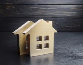 A collection of small model houses with cozy lighting, creating a warm and inviting atmosphere, AI