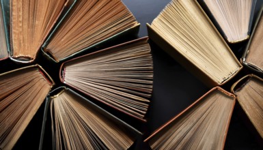 Old books arranged highlighting their historical significance. Neatly arranged representing a