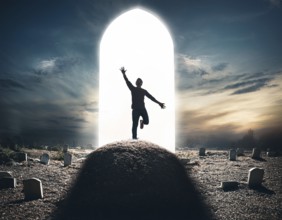 A silhouette of a lone figure walking off a gravestone, The scene evokes Resurrection thoughts