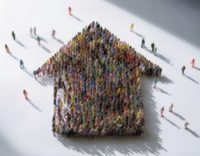 A concept photograph depicting numerous individuals arranged to form the shape of a house. Symbolic
