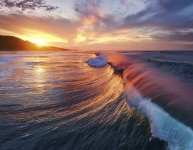 Vivid Ocean Wave Under Colorful Sunset with Dramatic Sky and Clouds, AI generated