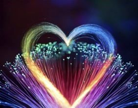 Colorful artistic display featuring vibrant light patterns shaped like a heart, expressing love and