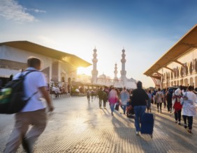 Travelers walk through an scanic architecture and culture of Muslim country, AI generated