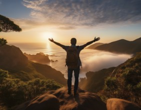 A serene scene of a person on a mountain summit, watching the sunrise over misty valleys, conveys