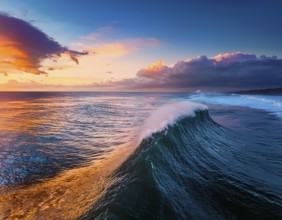 Vivid Ocean Wave Under Colorful Sunset with Dramatic Sky and Clouds, AI generated