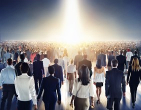 A group of individuals walks along the ground, silhouetted by a large setting sun, creating a