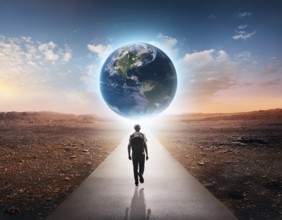 A surreal image of man walking on a boardwalk toward a large depiction of Earth surrounded by