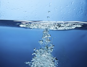High-quality image showing a splash of water pouring into a clean surface, symbolizing freshness,