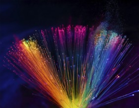 Glowing fiber-optic lights in vivid colors, creating a futuristic and dynamic visual effect, ideal