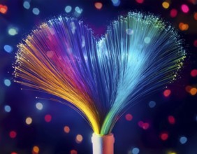 Colorful artistic display featuring vibrant light patterns shaped like a heart, expressing love and