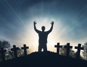 A silhouette of a lone figure walking off a gravestone, The scene evokes Resurrection thoughts