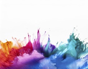 A vivid and dynamic display of multicolored paint splashing in motion against a pristine white