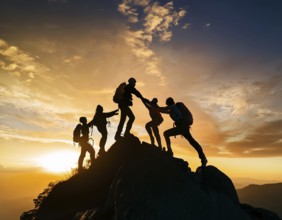 A dynamic depiction of teamwork and determination, climbers ascend a rugged mountain peak during