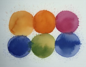 Colorful watercolor circles painted on a white background create a vibrant and artistic design.