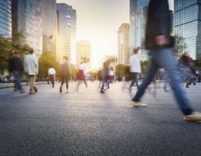 A dynamic scene featuring blurred people walking in a city street surrounded by skyscrapers and