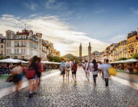 Historical city square with iconic architecture, cobblestone streets, and vibrant motion of