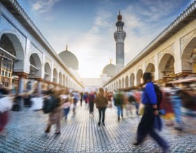 Travelers walk through an scanic architecture and culture of Muslim country, AI generated