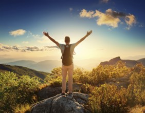 A serene scene of a person on a mountain summit, watching the sunrise over misty valleys, conveys