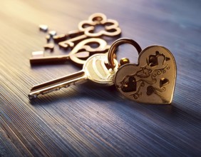 Elegant heart-shaped locket and intricate key on textured surface, surrounded by glowing hearts. An