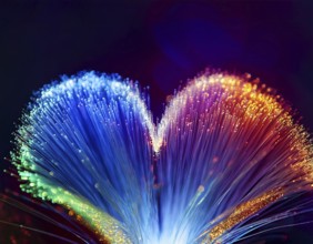 Colorful artistic display featuring vibrant light patterns shaped like a heart, expressing love and